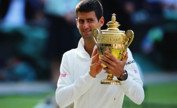 Novak Djokovic with Wimbledon 2014 trophy